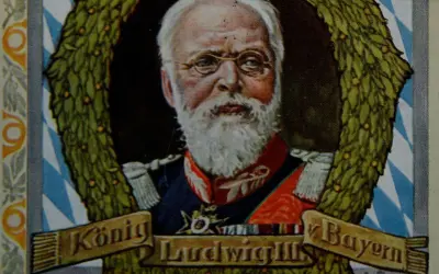 König Ludwig III. von Bayern, mit weißem Bart und Brille, umrahmt von einem Lorbeerkranz.