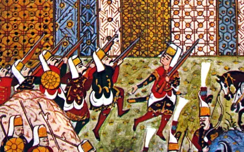 Soldaten mit Gewehren, vielleicht Johanniter-Kreuzritter, kämpfen vor bunten Wandteppichen.